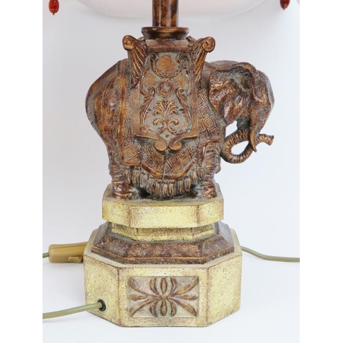 128 - A European pair of decorative Indian elephant table lamps, 20th century. (2 items) 53 cm total heigh... 