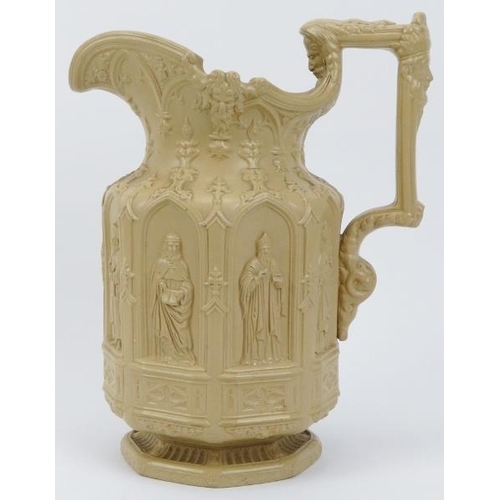 21 - An early Victorian ecclesiastical gothic stoneware jug designed by Charles Meigh. Impressed mark ben... 