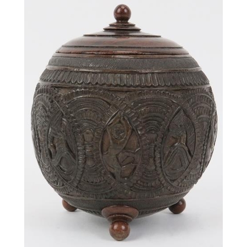 33 - An Anglo Indian carved coconut tea caddy, late 19th/20th century. Carved with bands of decoration an... 