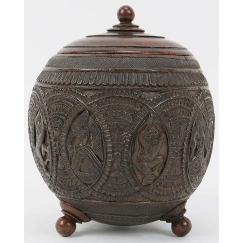 33 - An Anglo Indian carved coconut tea caddy, late 19th/20th century. Carved with bands of decoration an... 