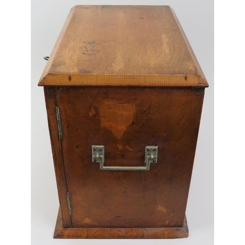 38 - A vintage smokers compendium, circa 1920/30s. With twin doors opening to reveal two draws above a re... 