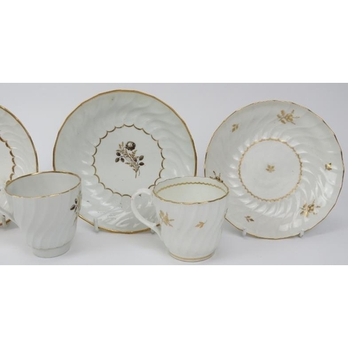 4 - A group of four early Worcester porcelain gilt decorated white cups and saucers, late 18th/early 19t... 