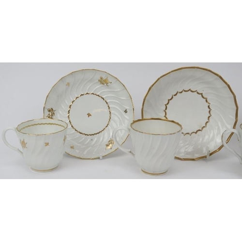 4 - A group of four early Worcester porcelain gilt decorated white cups and saucers, late 18th/early 19t... 