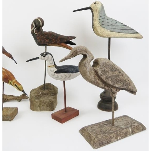 44 - A group of eight hand carved and painted wooden sculptures of birds on stands. (8 items) 46 cm talle... 