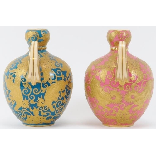 48 - Two rare Royal Crown Derby twin handled vases, circa 1884-85. Both of ovoid form with scale handles,... 