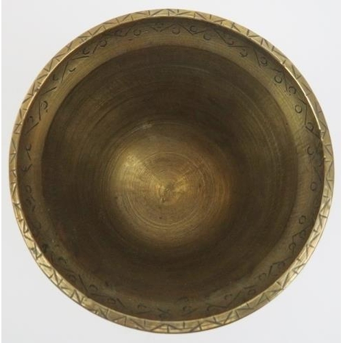 51 - Two Middle Eastern engraved and inlaid brass wares, 20th century. Comprising a circular tray with fo... 