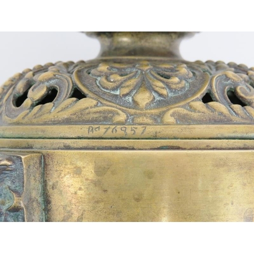 54 - A group of brassware items, 19th/20th century. Comprising a Victorian pierced brass receptacle with ... 