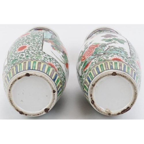 56 - A pair of Chinese Famille verte porcelain vases, late Qing dynasty. Decorated with panels depicting ... 