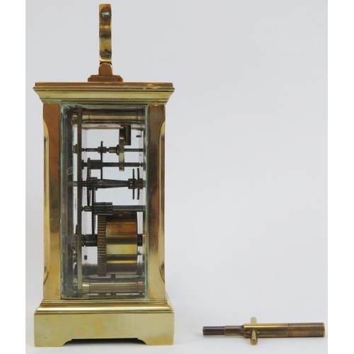 58 - An English brass carriage clock by Huber, late 19th/early 20th century. With bevelled glass, enamell... 