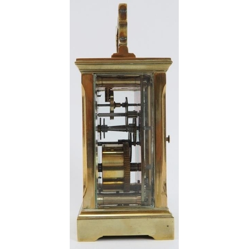 58 - An English brass carriage clock by Huber, late 19th/early 20th century. With bevelled glass, enamell... 