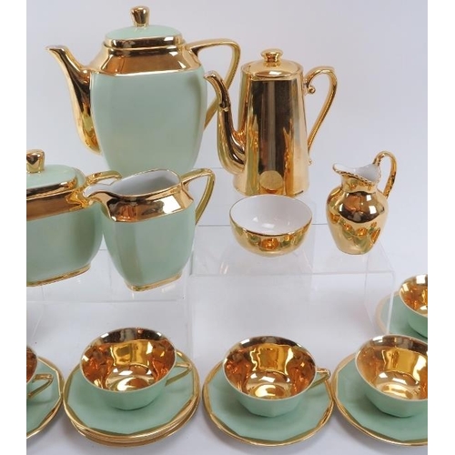 83 - A Limoges ‘R.G. Montigny’ pattern tea set and a Royal Worcester ‘Fireproof’ set. Twenty one pieces o... 