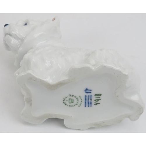 88 - Two Royal Copenhagen porcelain dogs. Comprising a West Highland Terrier and a Dachshund. Both marked... 