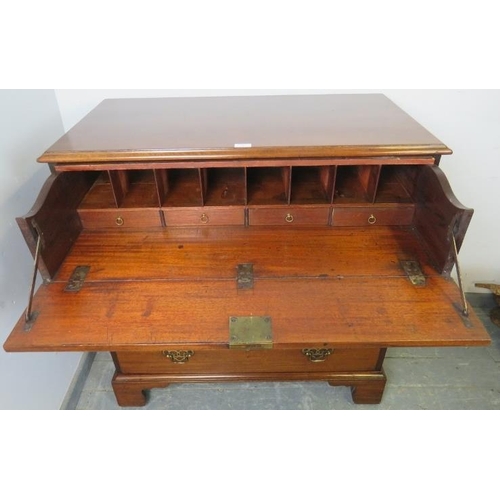 704 - A George III secretaire chest of small proportions, the fall front secretaire section housing a fitt... 