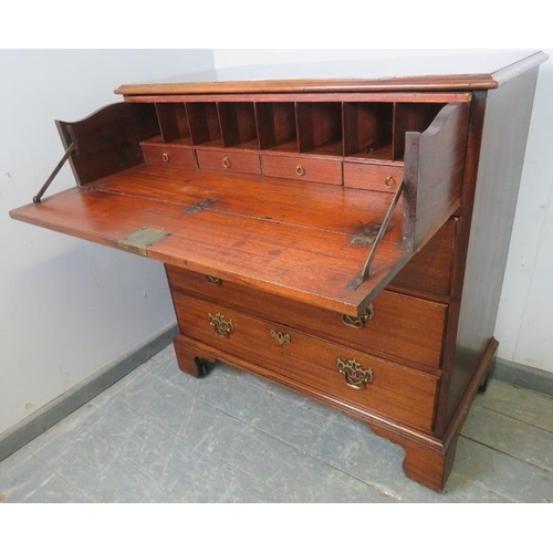 704 - A George III secretaire chest of small proportions, the fall front secretaire section housing a fitt... 