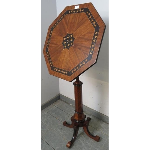 706 - A 19th century mahogany octagonal tilt-top table/music stand with ebonised and satinwood foliate inl... 