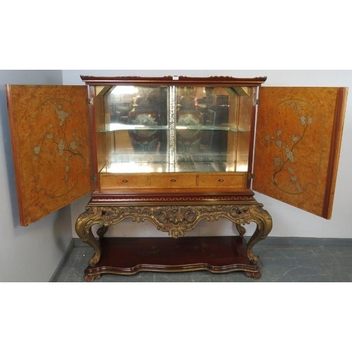 716 - A vintage Art Deco Revival Chinoiserie drinks cabinet, the doors opening onto a maplewood-lined fitt... 