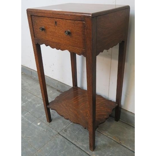 725 - An Edwardian Georgian Revival oak side table, with single drawer and shaped apron, on square support... 