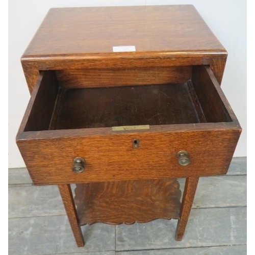 725 - An Edwardian Georgian Revival oak side table, with single drawer and shaped apron, on square support... 