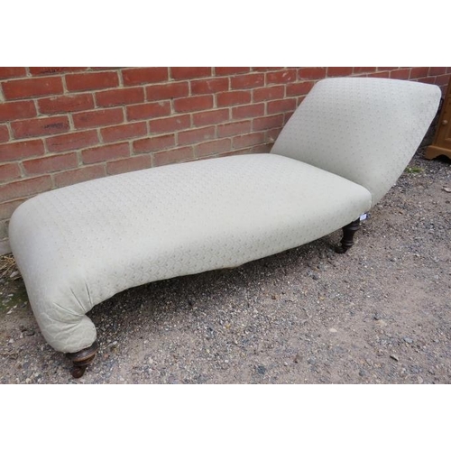 731 - A Victorian chaise longue of small proportions, re-upholstered in Art Deco style patterned material,... 