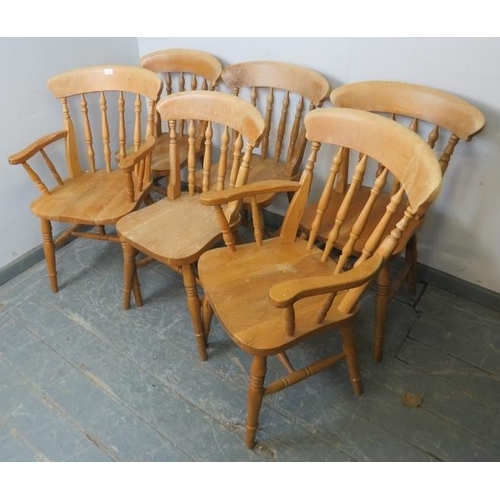 734 - A set of six (4+2) light oak farmhouse kitchen chairs with spindle backs, on turned canted supports ... 