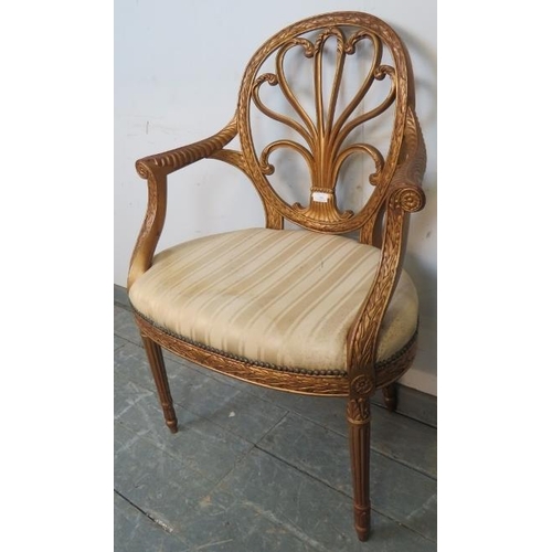 735 - A vintage giltwood open-sided elbow chair in the Louis XV taste, the pierced back with scrolling aca... 