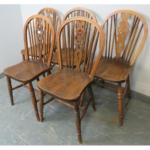 738 - Five elm wheelback dining chairs, on turned supports with an ‘H’ stretcher. 
H89cm W41cm D47cm (appr... 