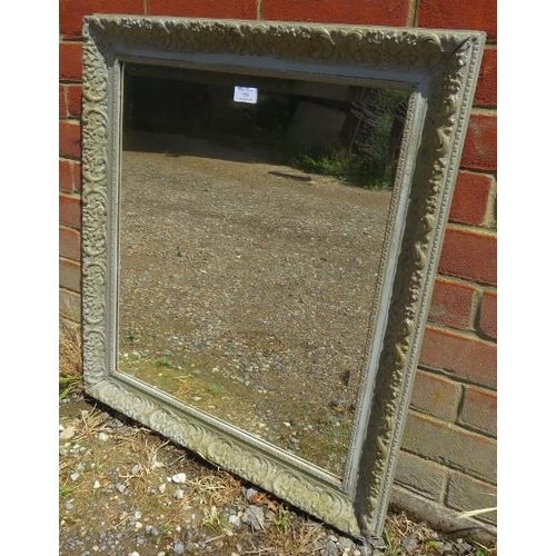 754 - An antique gesso bevelled wall mirror, the moulded surround painted grey and distressed.  
H75cm W66... 