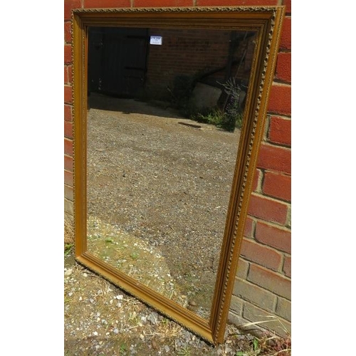 755 - A rectangular bevelled wall mirror, in an antique style gilt gesso surround.
H98cm W71cm D4cm (appro... 