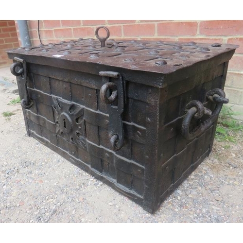 756 - A late 17th/early 18th century Armada chest, of cast iron strapwork construction, the lid with 7-poi... 