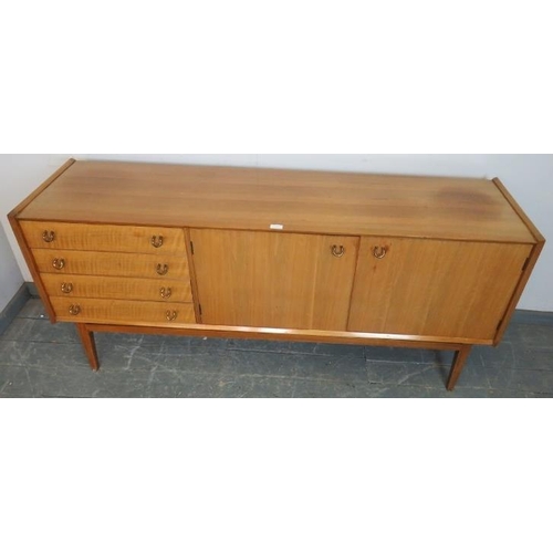 759 - A mid-century teak sideboard by Waring & Gillow, housing four short drawers, one with cutlery cantee... 