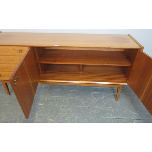 759 - A mid-century teak sideboard by Waring & Gillow, housing four short drawers, one with cutlery cantee... 