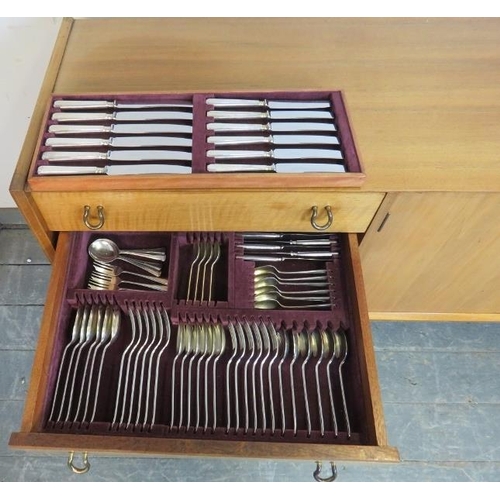 759 - A mid-century teak sideboard by Waring & Gillow, housing four short drawers, one with cutlery cantee... 