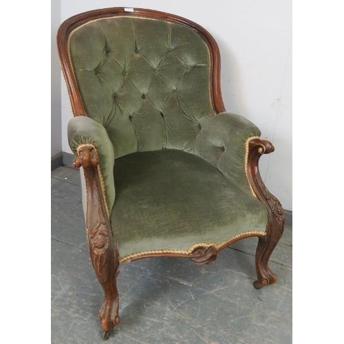 769 - A Victorian mahogany show wood button back armchair, upholstered in green velvet material with gold ... 