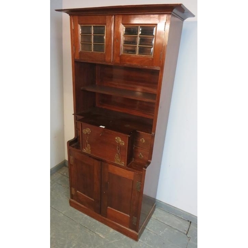 770 - An Art Nouveau mahogany bureau bookcase in the manner of Liberty, having glazed and bevelled twin do... 