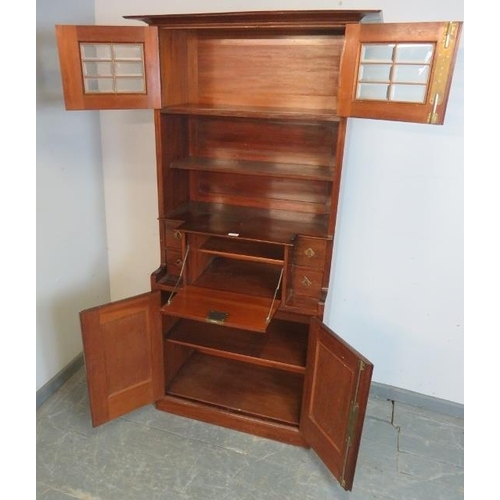 770 - An Art Nouveau mahogany bureau bookcase in the manner of Liberty, having glazed and bevelled twin do... 