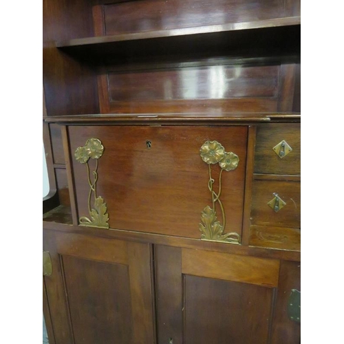 770 - An Art Nouveau mahogany bureau bookcase in the manner of Liberty, having glazed and bevelled twin do... 