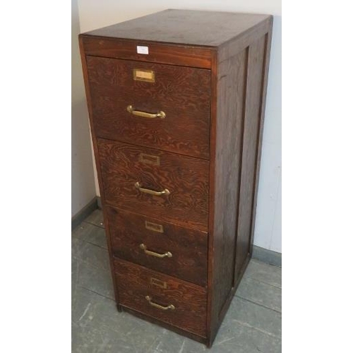 771 - A vintage filing cabinet of four long and deep drawers with cast brass handles and label holders. St... 