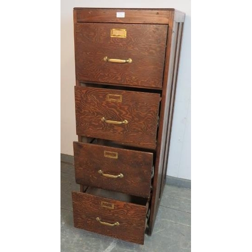 771 - A vintage filing cabinet of four long and deep drawers with cast brass handles and label holders. St... 