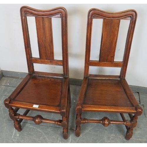 772 - A pair of early 18th century Provincial elm side chairs in the Queen Anne taste, possibly Welsh, on ... 