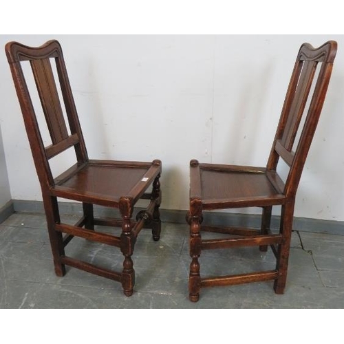 772 - A pair of early 18th century Provincial elm side chairs in the Queen Anne taste, possibly Welsh, on ... 