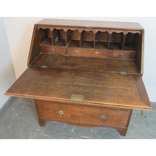 779 - An 18th century oak bureau, the fall front opening onto a fitted interior, above two short and two l... 