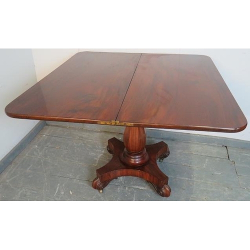 785 - A Victorian mahogany turnover tea table, on an octagonal baluster pedestal, above a quatreform base ... 