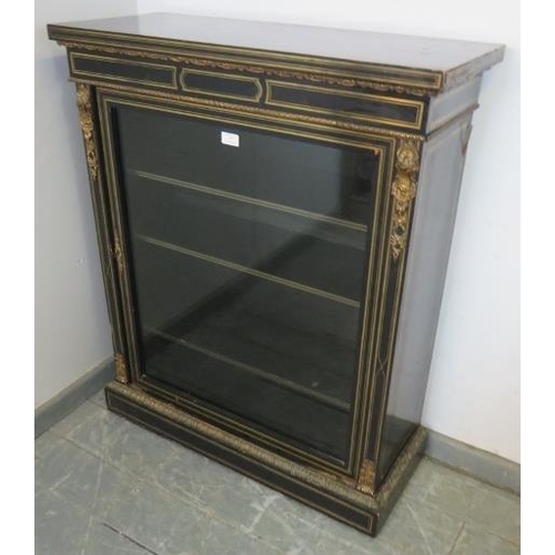 787 - A 19th century ebonised pier cabinet with ormolu mounts and brass inlay, the glazed door opening ont... 