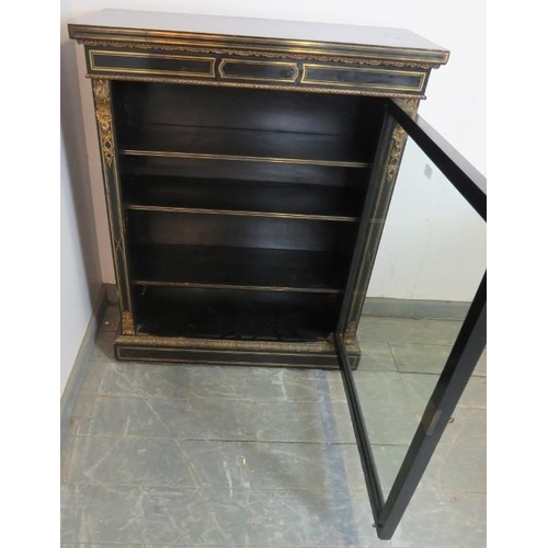 787 - A 19th century ebonised pier cabinet with ormolu mounts and brass inlay, the glazed door opening ont... 