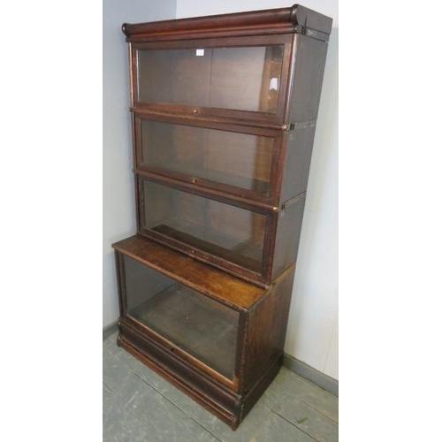 794 - A vintage oak Globe-Wernicke style glazed bookcase of four graduated stacking sections, on a plinth ... 