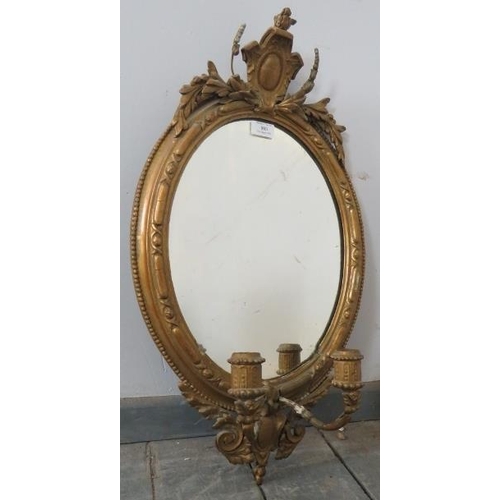 803 - A 19th century oval girandole wall mirror in an ornate gilt gesso surround featuring moulded cornice... 