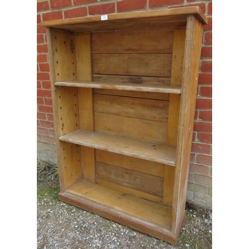 808 - An antique stripped pine open bookcase, of two height-adjustable shelves, on a plinth base.
H127cm W... 