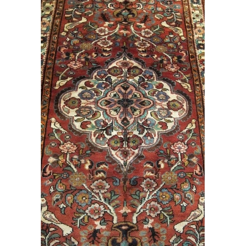 946 - North West Persian Sarouk Mahal Kelleh, lovely quality carpet with central motif on pink ground and ... 