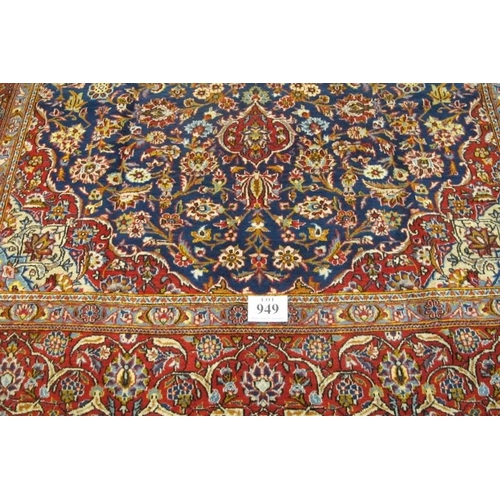 949 - A fine central Persian Kashan carpet. central motif on blue ground and in excellent condition. 335 x... 