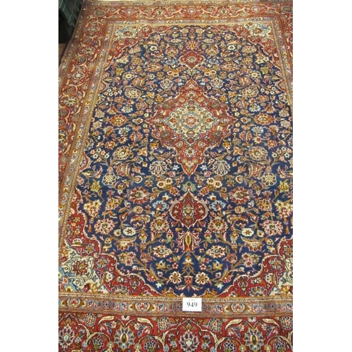 949 - A fine central Persian Kashan carpet. central motif on blue ground and in excellent condition. 335 x... 